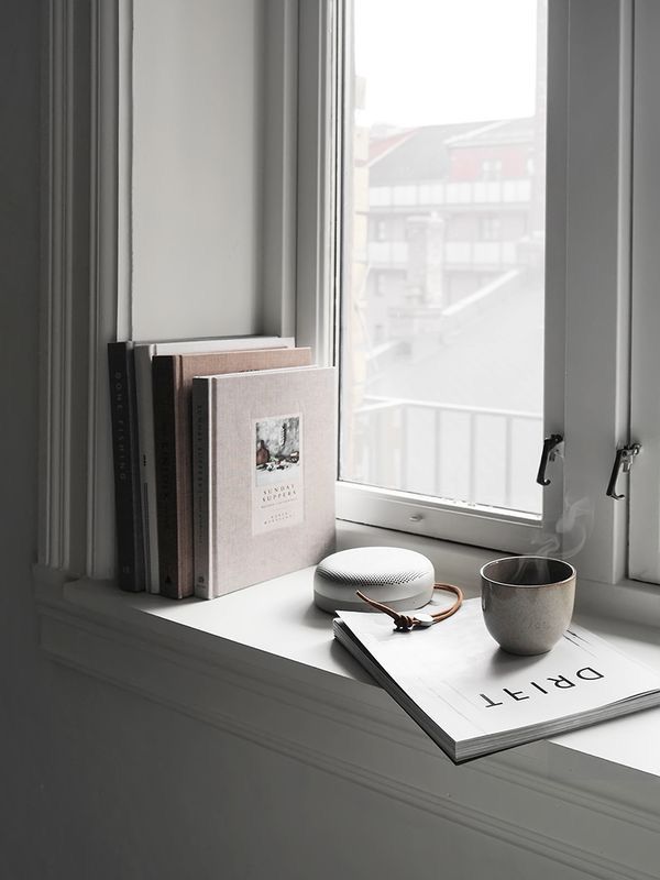 Organized corner with journal, herbal tea, and warm lamp